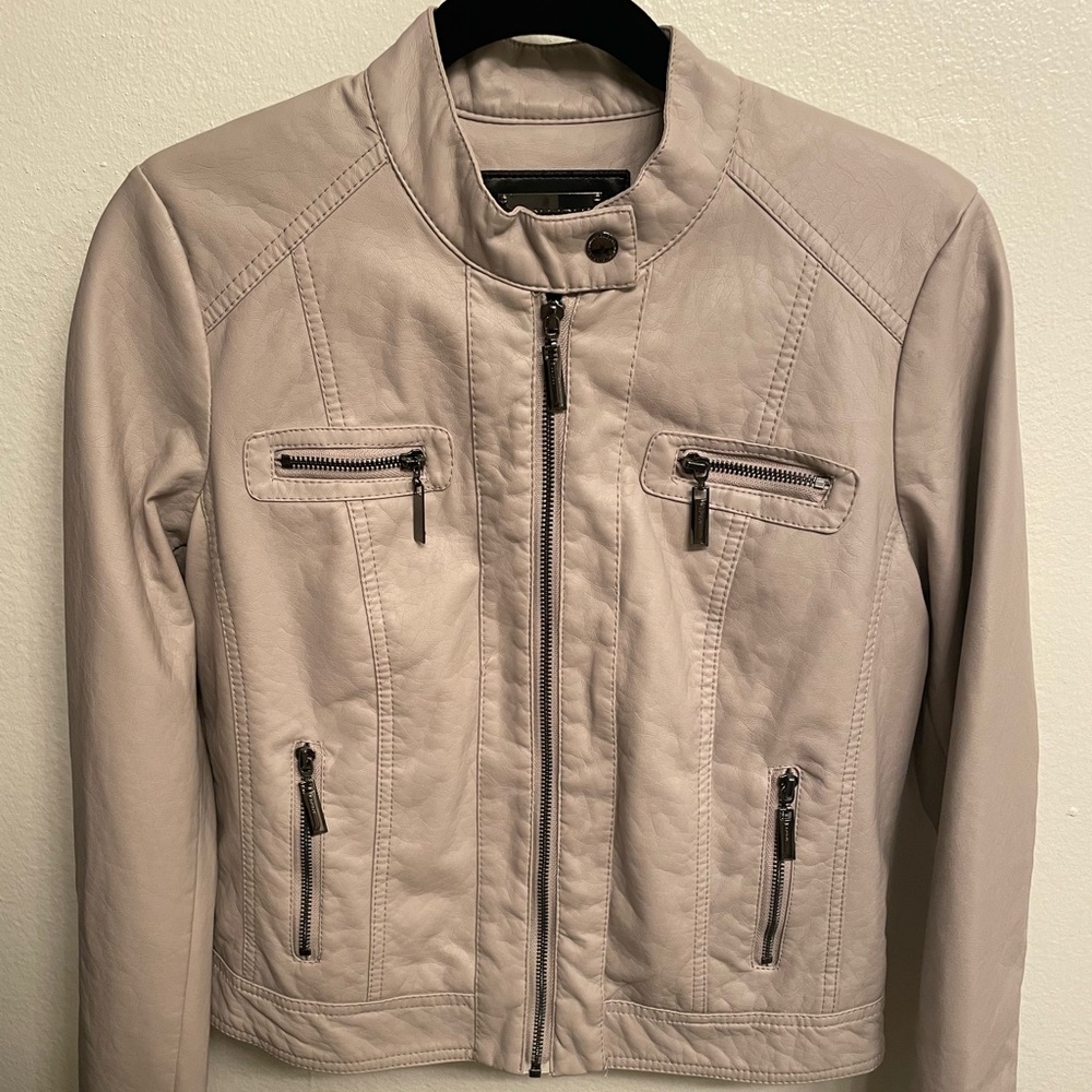 Vegan Leather jacket with furry interior lining.